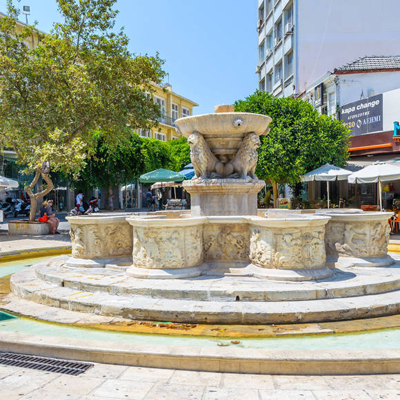 View of the Lions Fountain in Heraklion, Crete, with its iconic lion statues and historical architecture